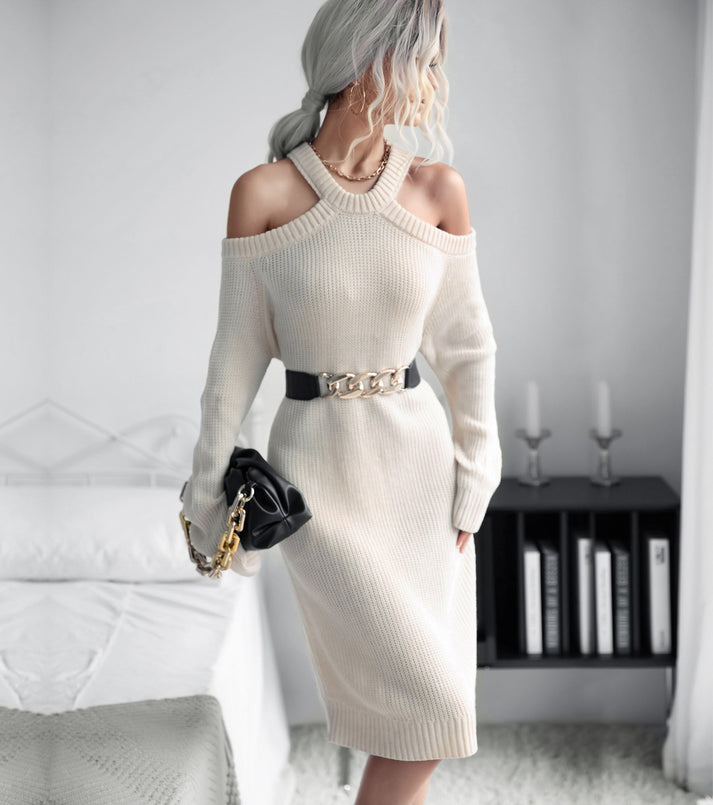 Sweater dress with heeled boots and gold jewelry